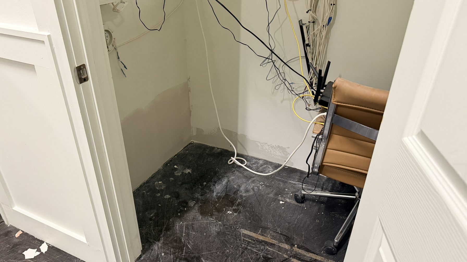 Low-voltage wiring in a utility closet opened during a rebuild