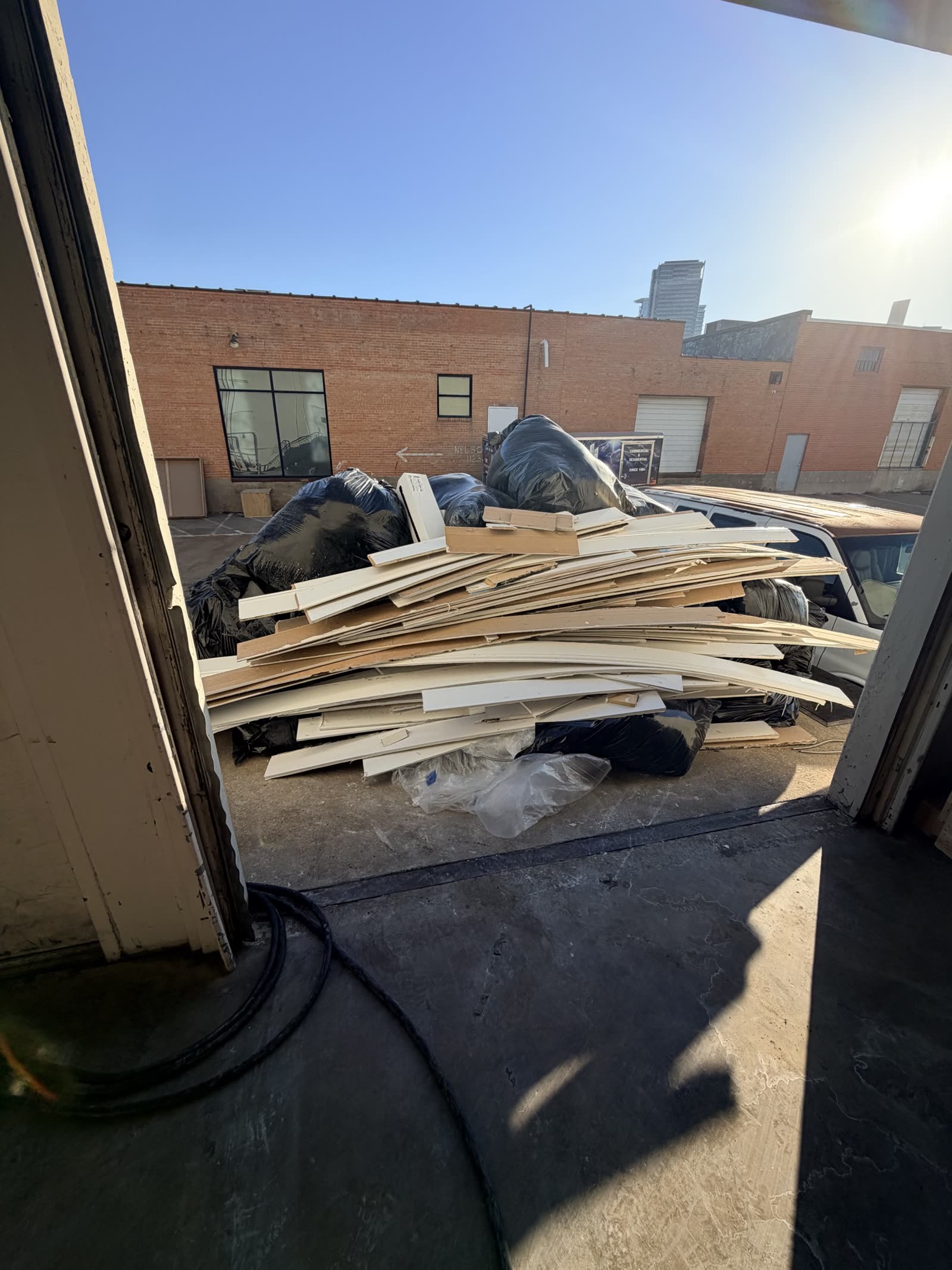 Fort Worth — wet trim and debris leaving the building