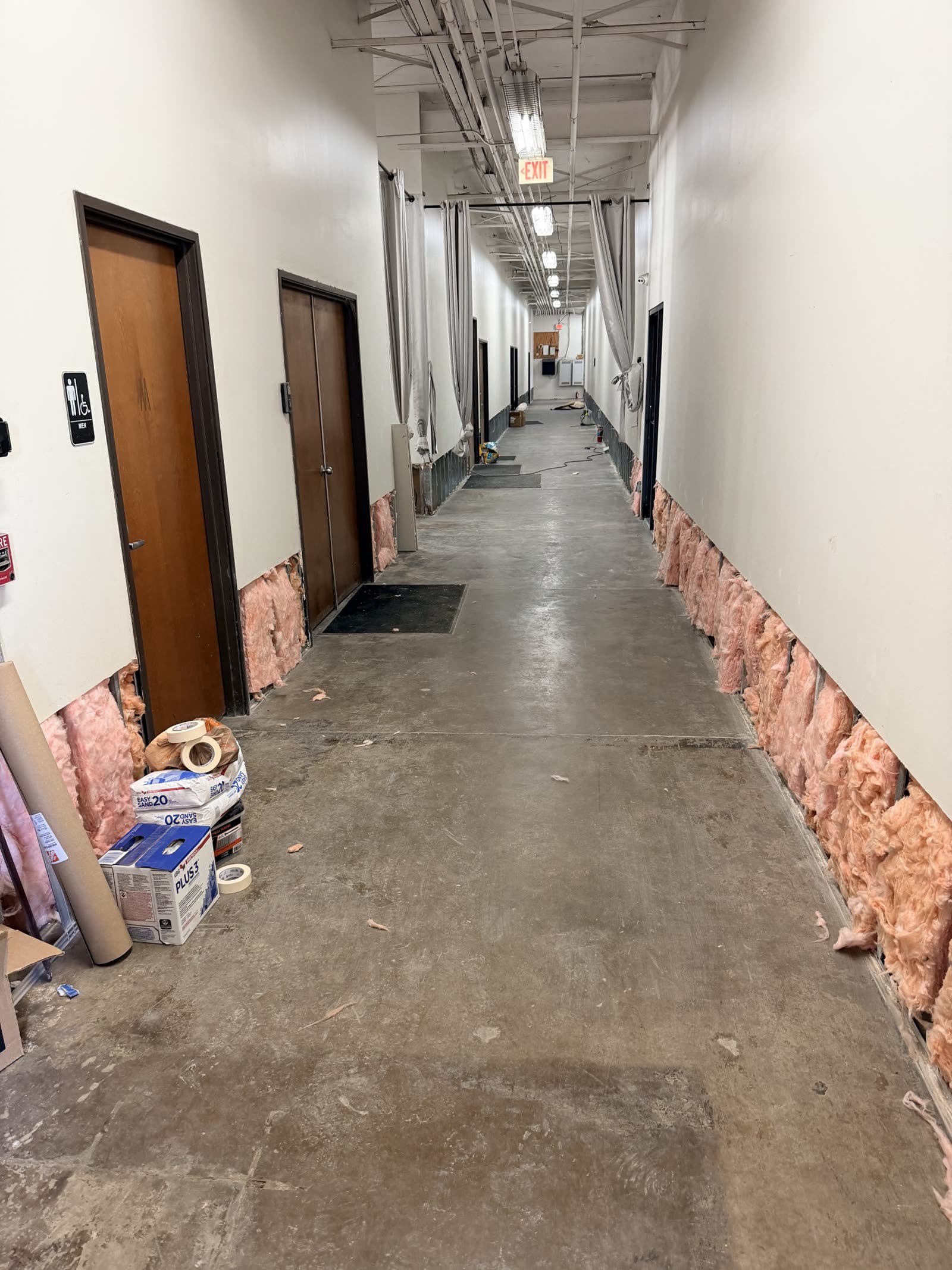 Fort Worth — corridor base opened to insulation after water damage