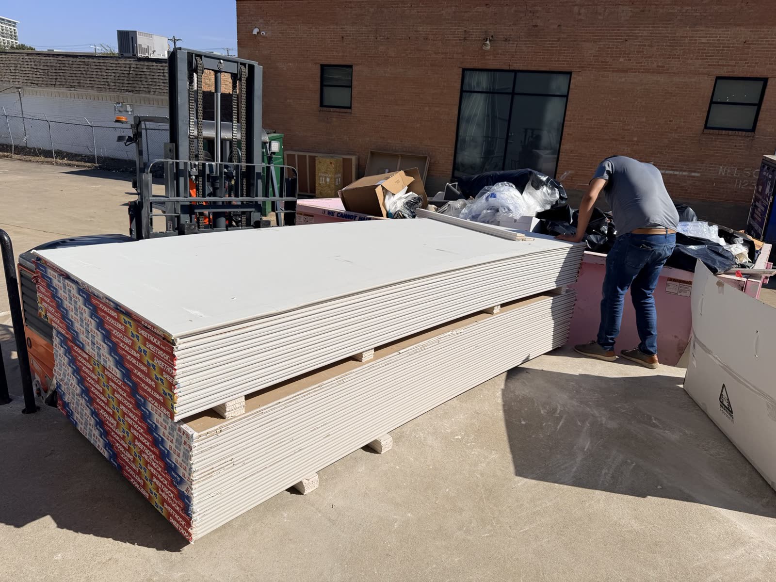 Fort Worth — sheetrock staged for the corridor rebuild