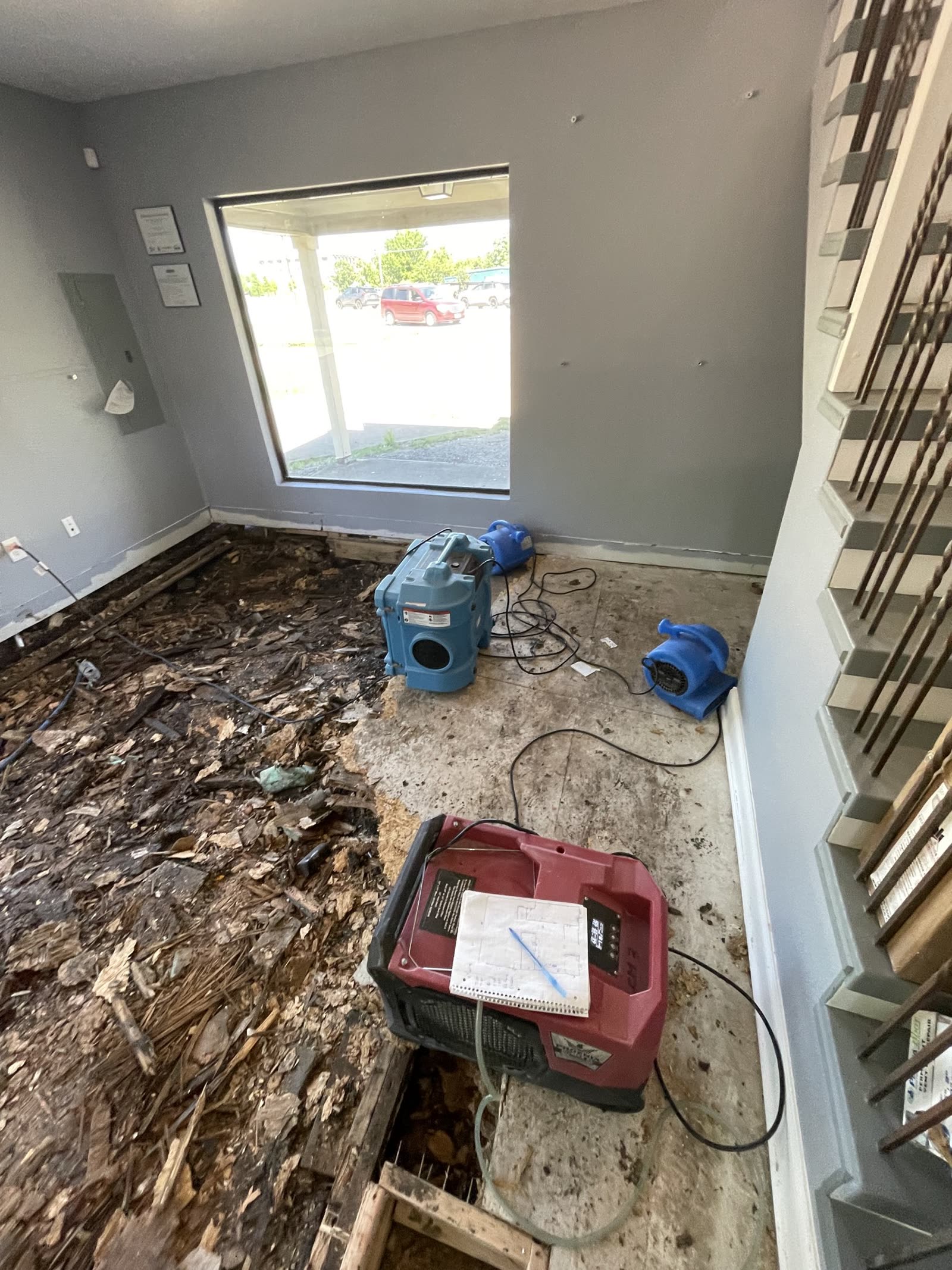 Fort Worth — dehumidifier and air movers next to the opened floor