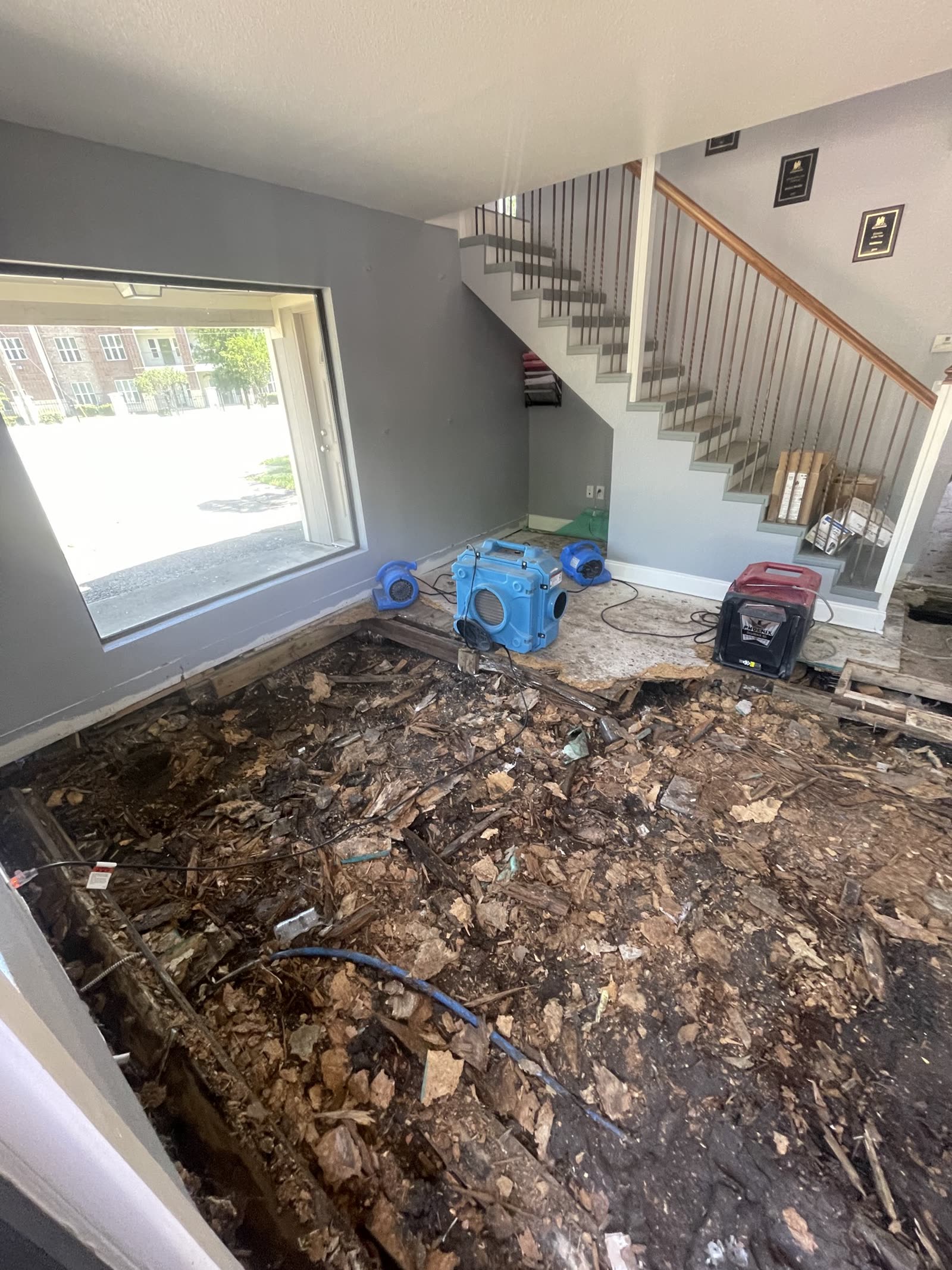 Fort Worth — opened floor to the crawl with drying equipment at the stairs