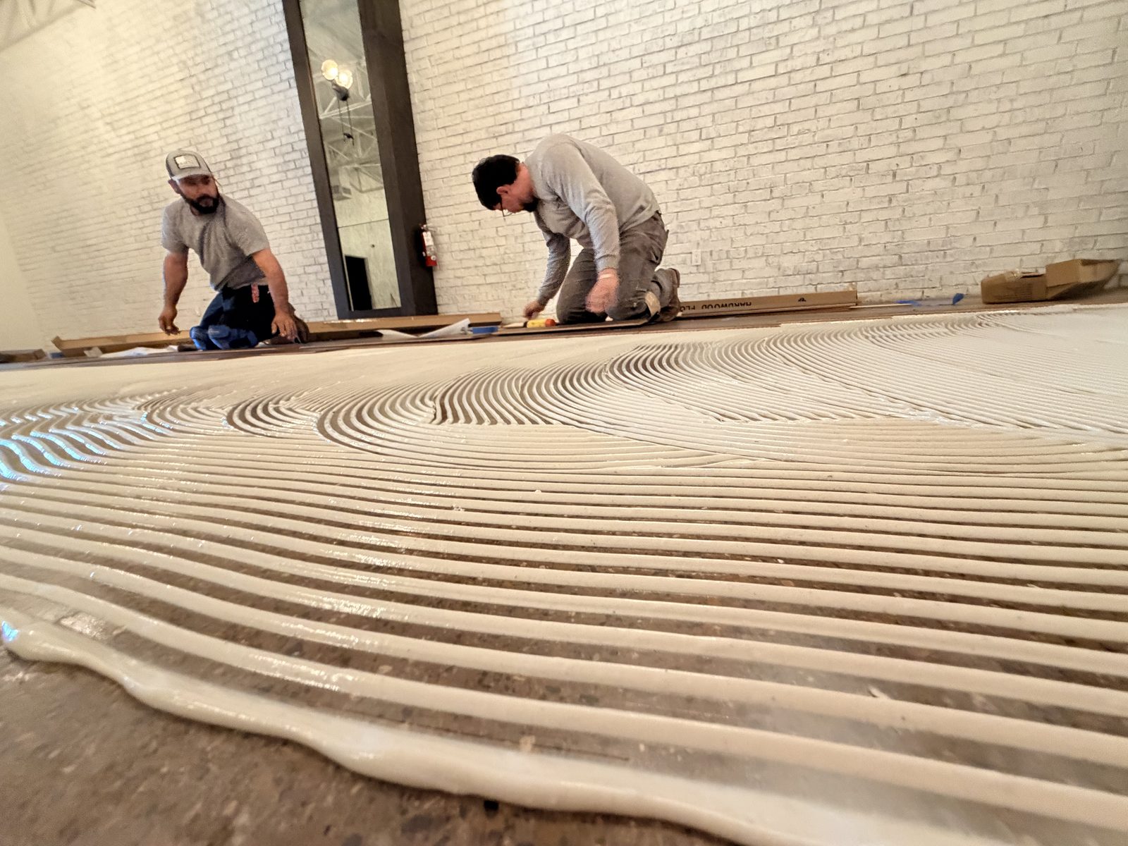 Dallas Design District — adhesive across the slab