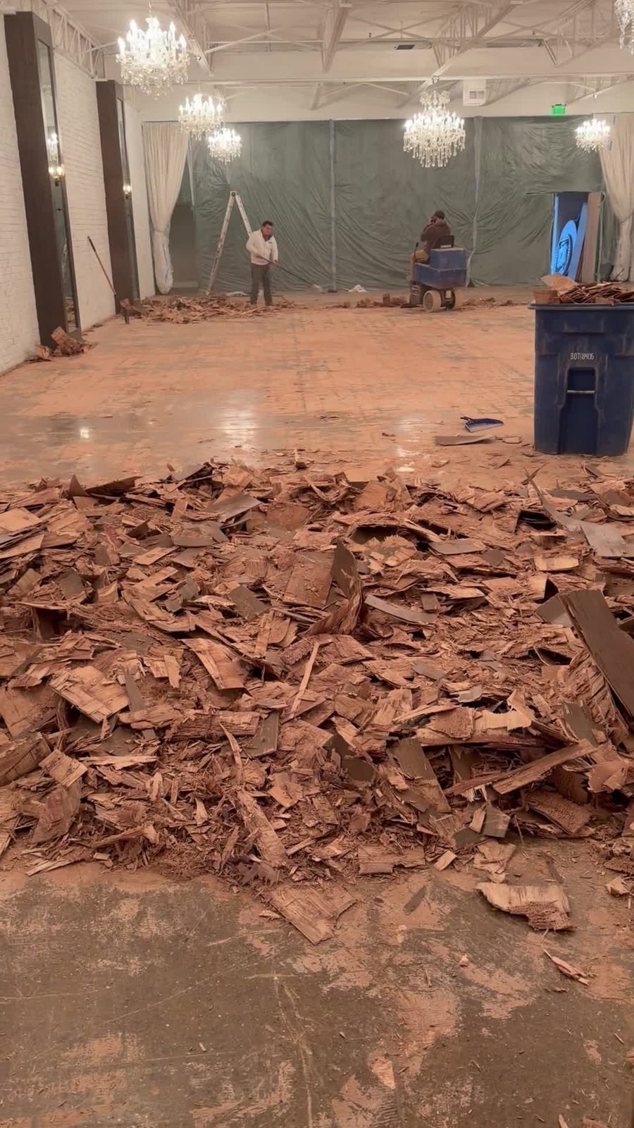 Dallas Design District — failed floor coming up — demo debris in the suite