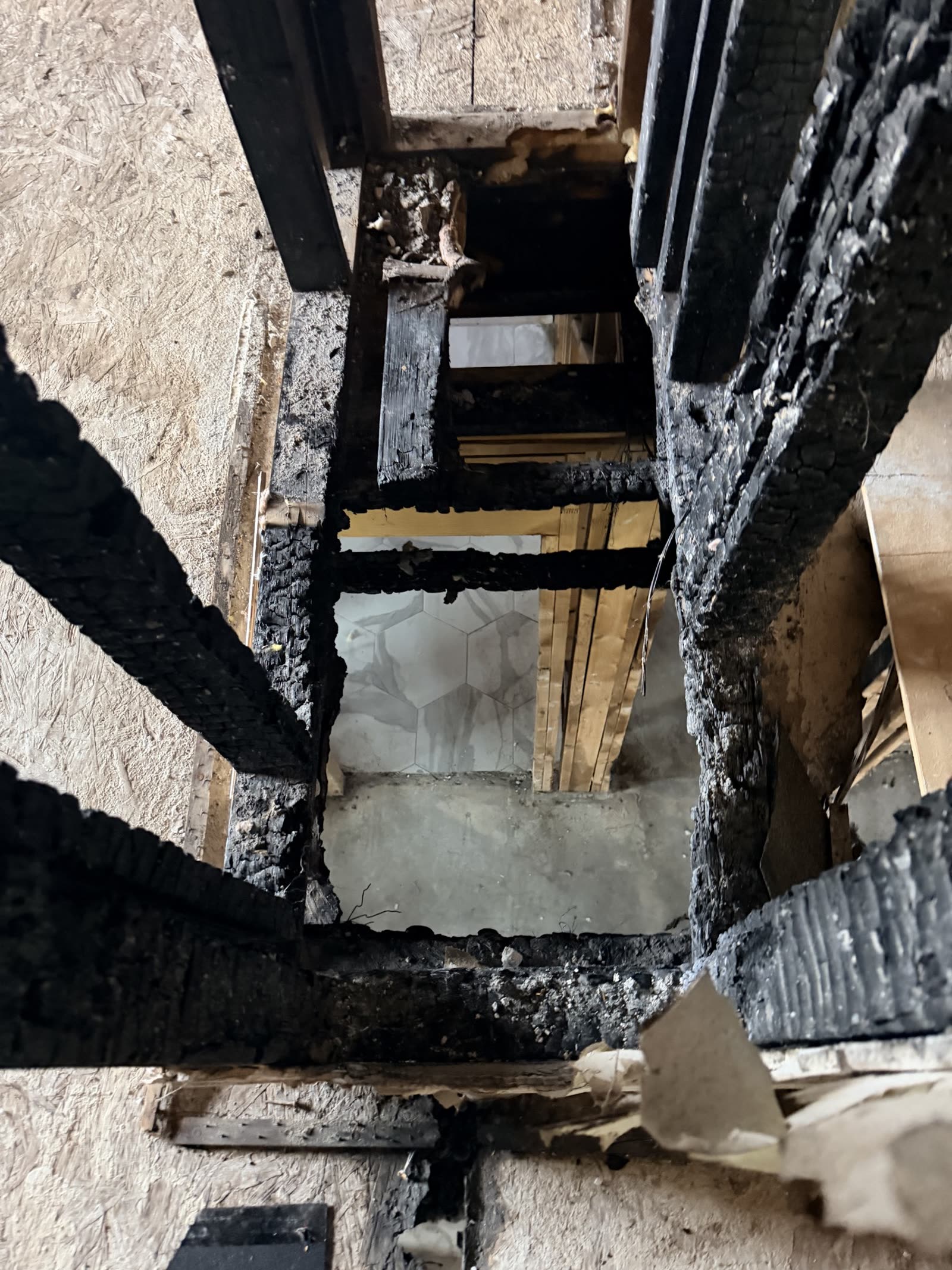 Fort Worth — floor framing burned through to the bathroom below