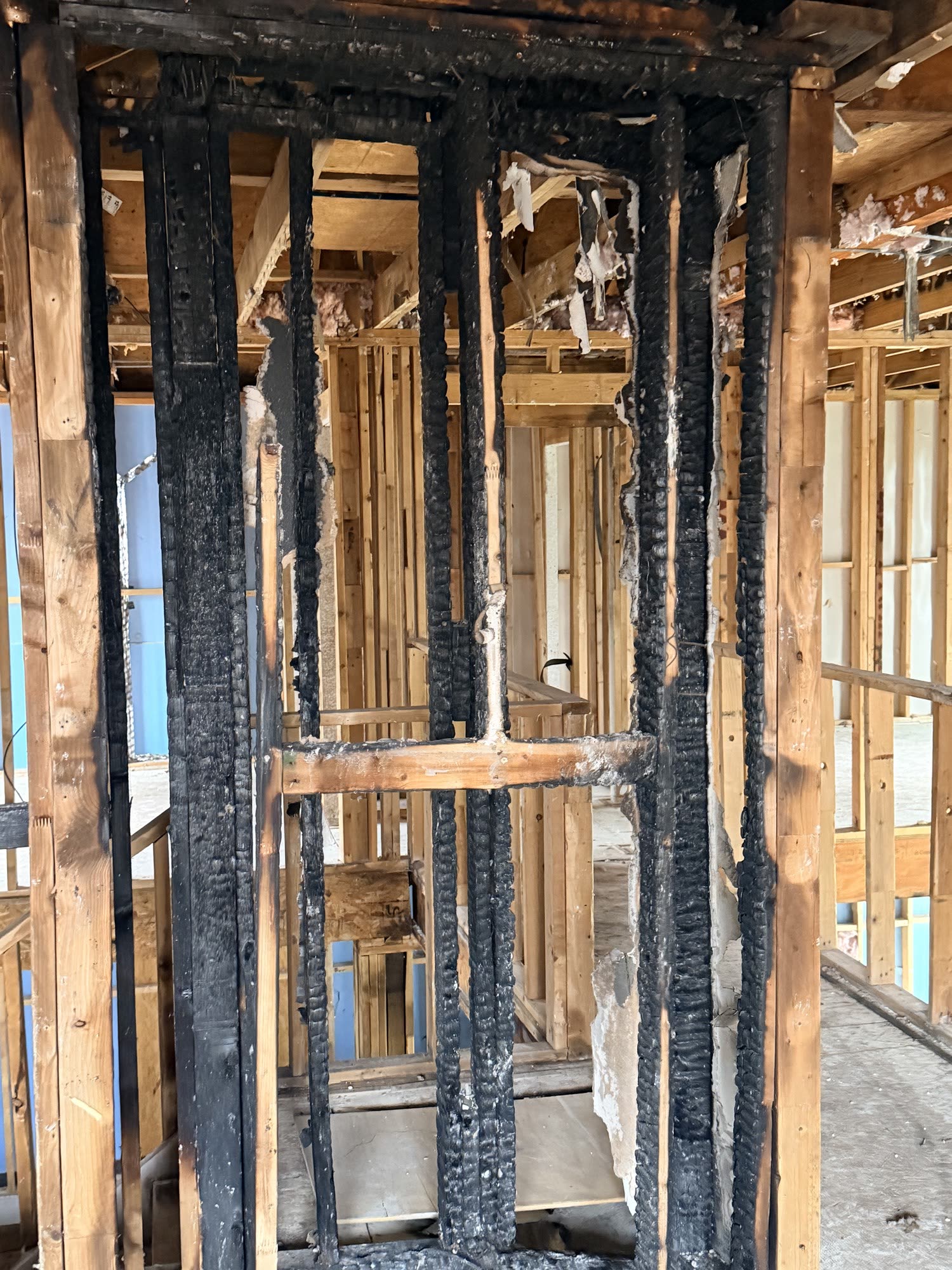 Fort Worth — charred ceiling framing close