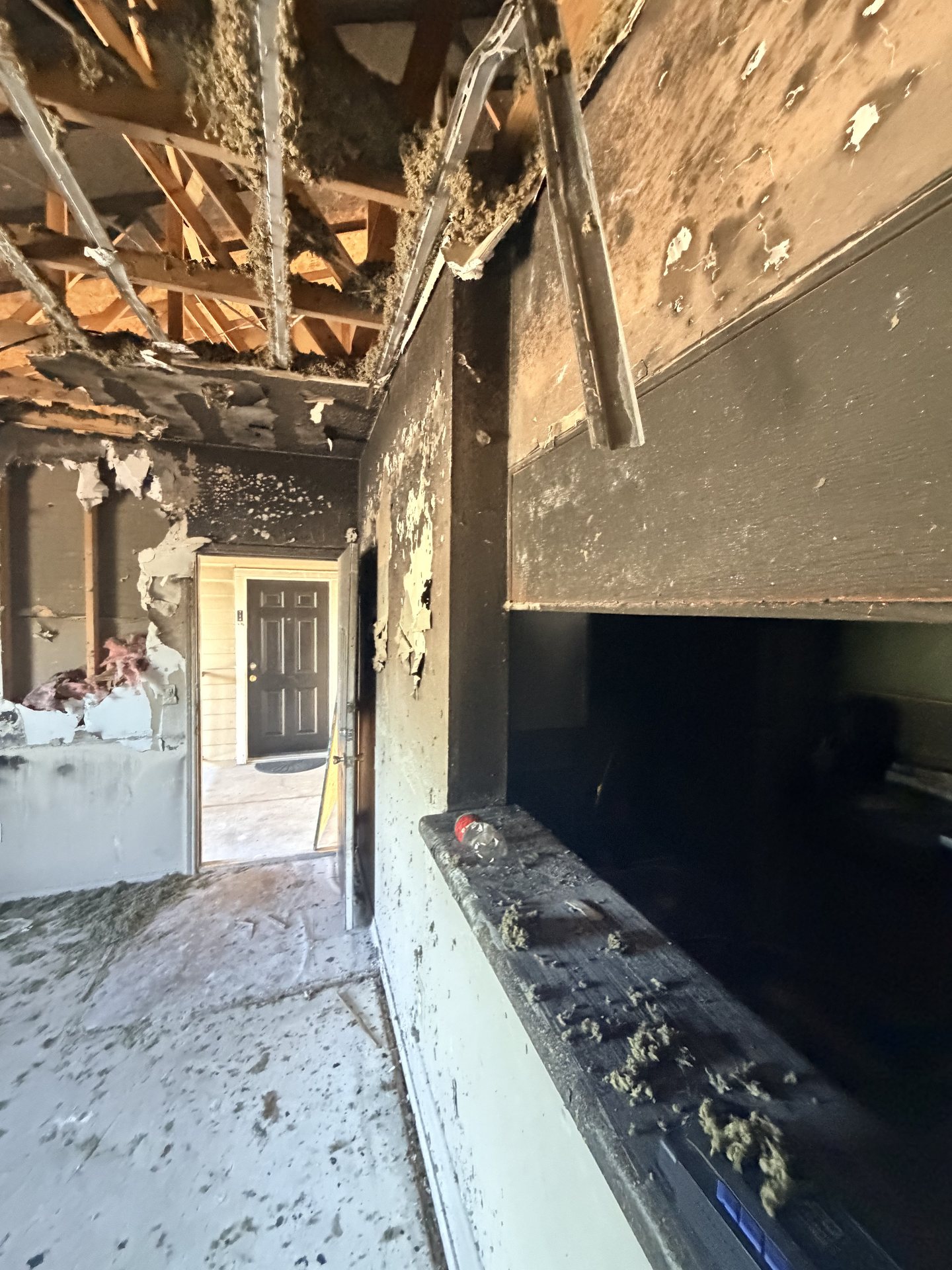 Fort Worth — charred ceiling cavity after a house fire