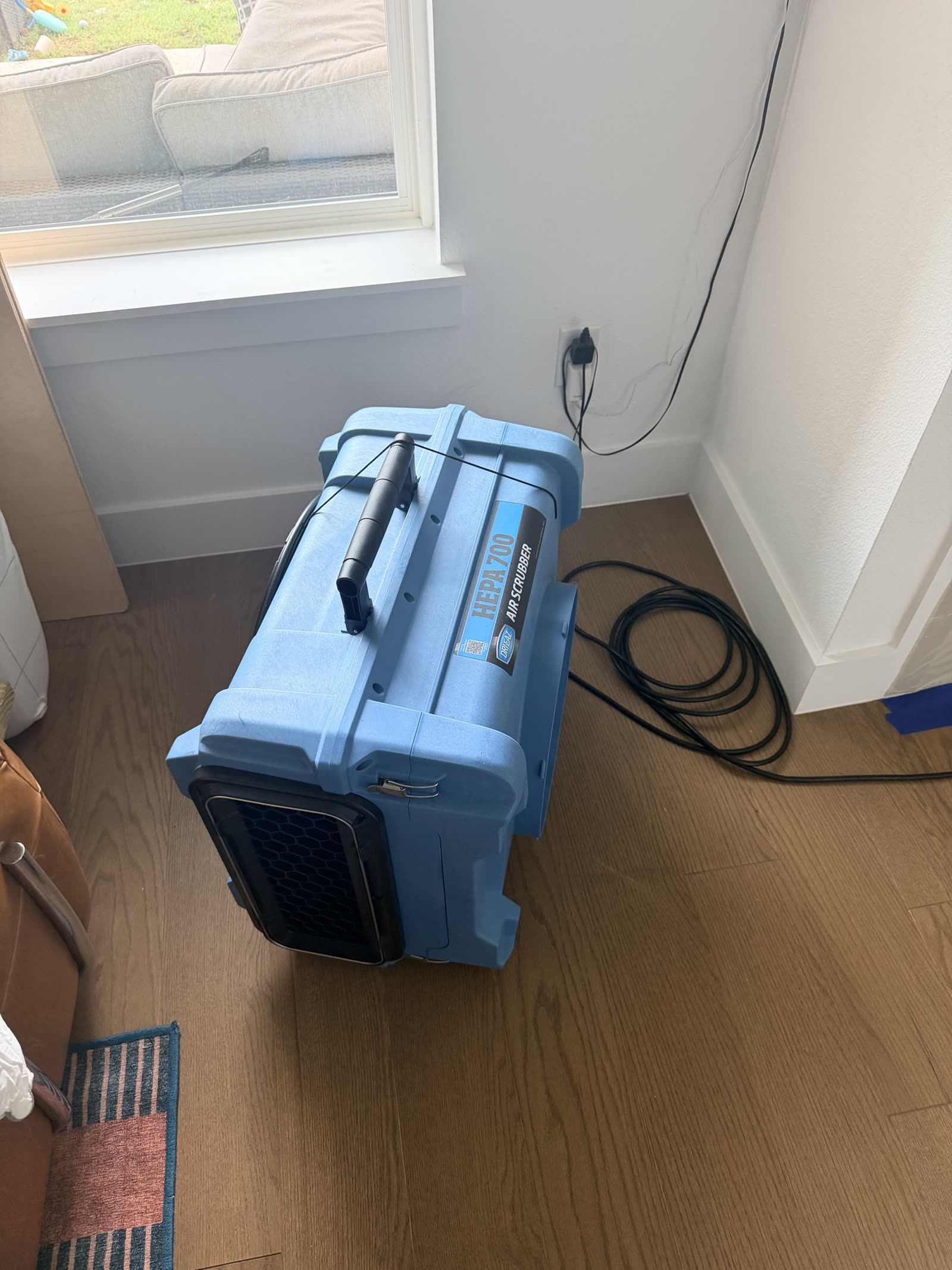 HEPA air scrubber running in an occupied room