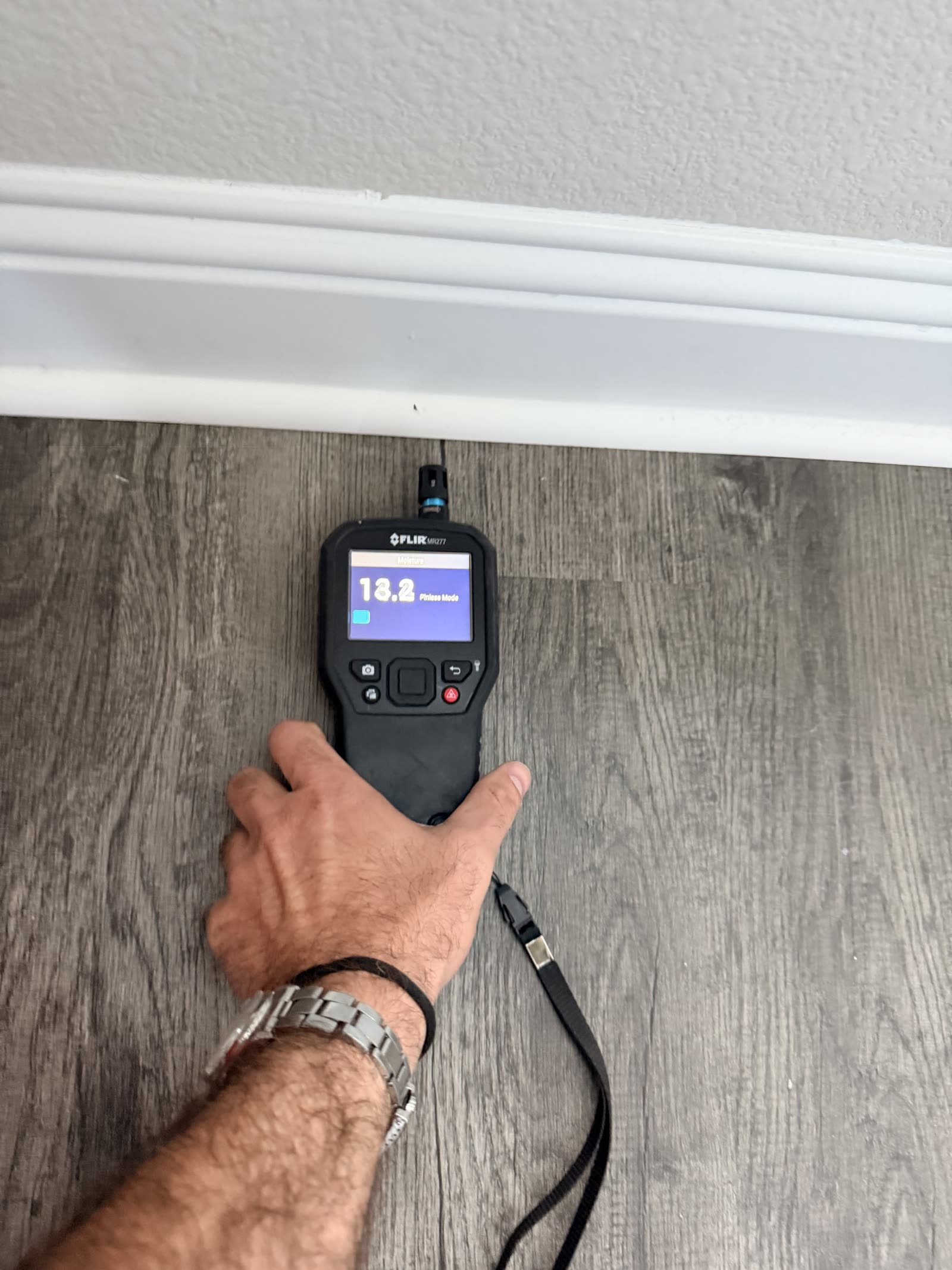 Fort Worth — pinless moisture reading 13.2 at the baseboard