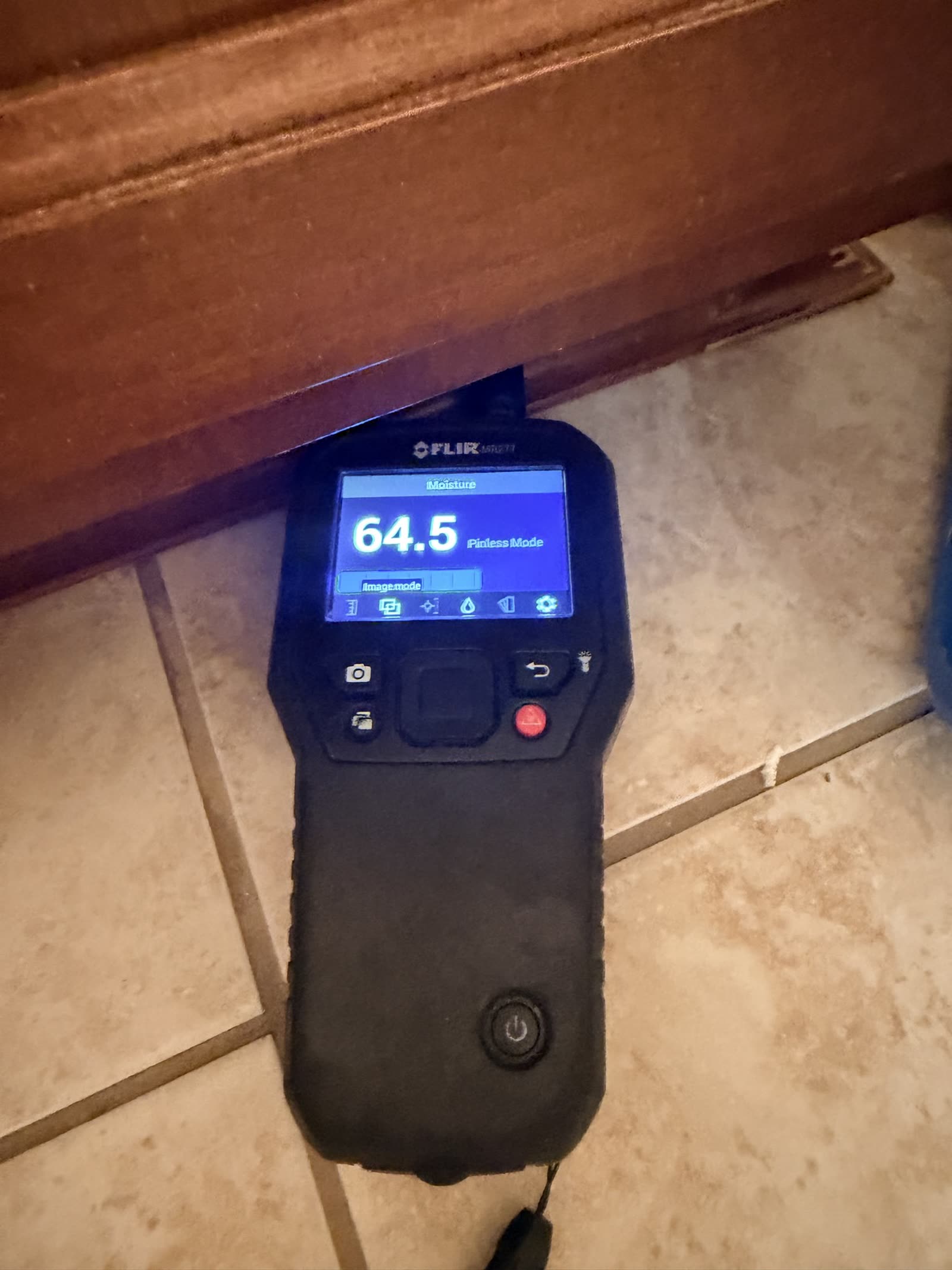 Fort Worth — moisture meter 64.5 under a vanity