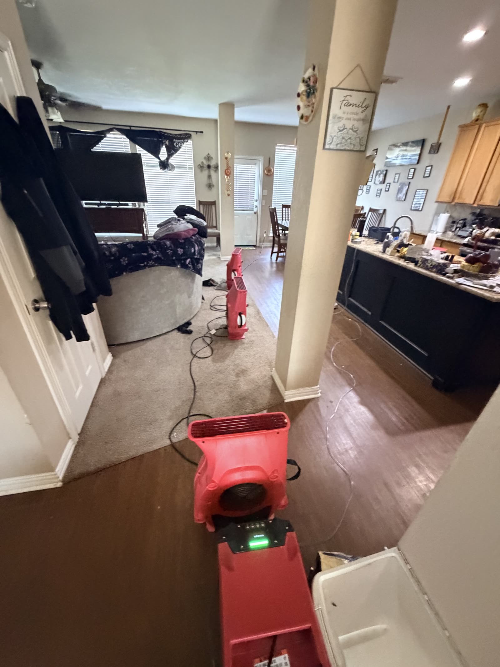 Fort Worth — occupied living room with drying equipment