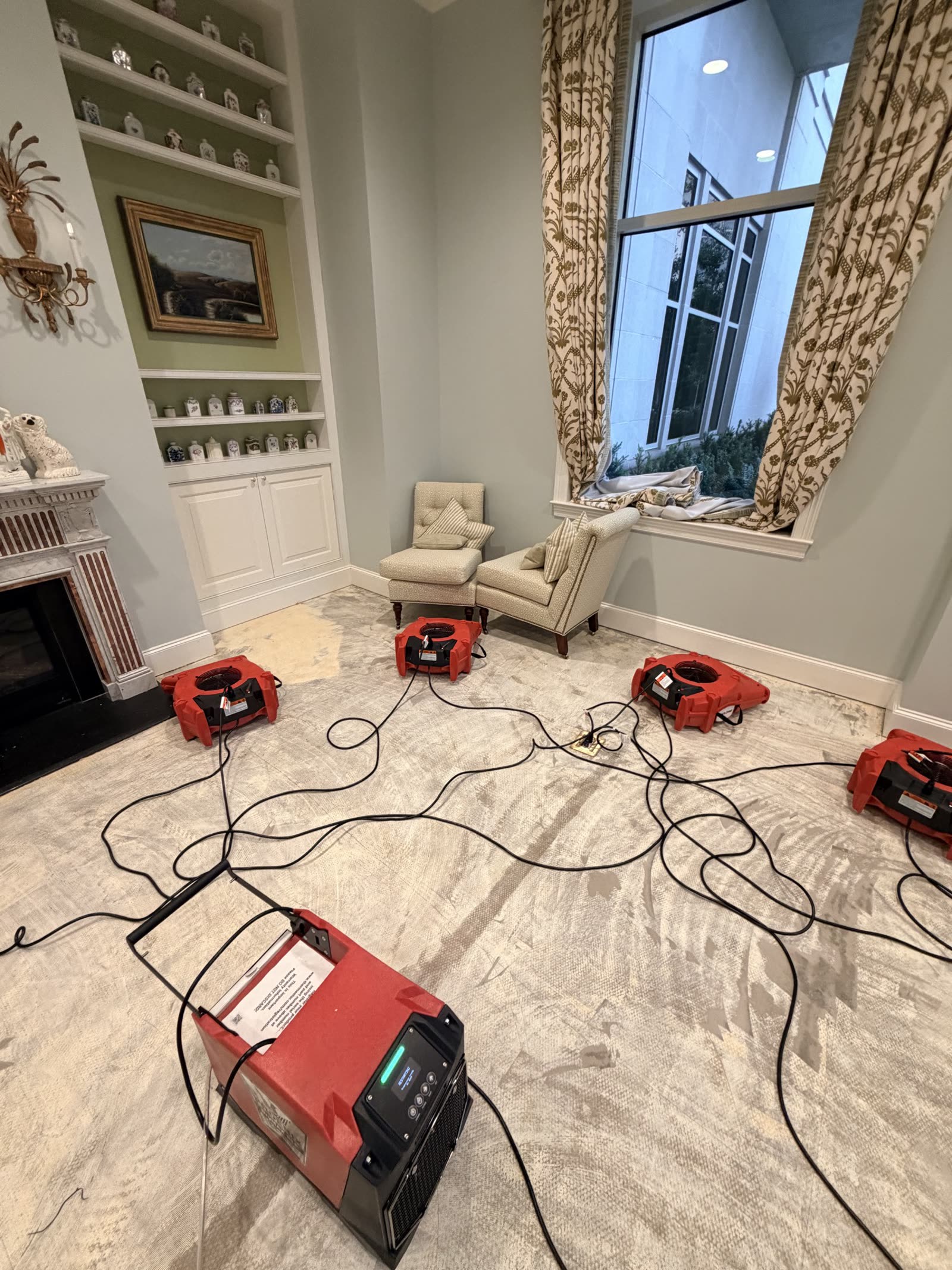 Fort Worth — air movers in a furnished sitting room during drying