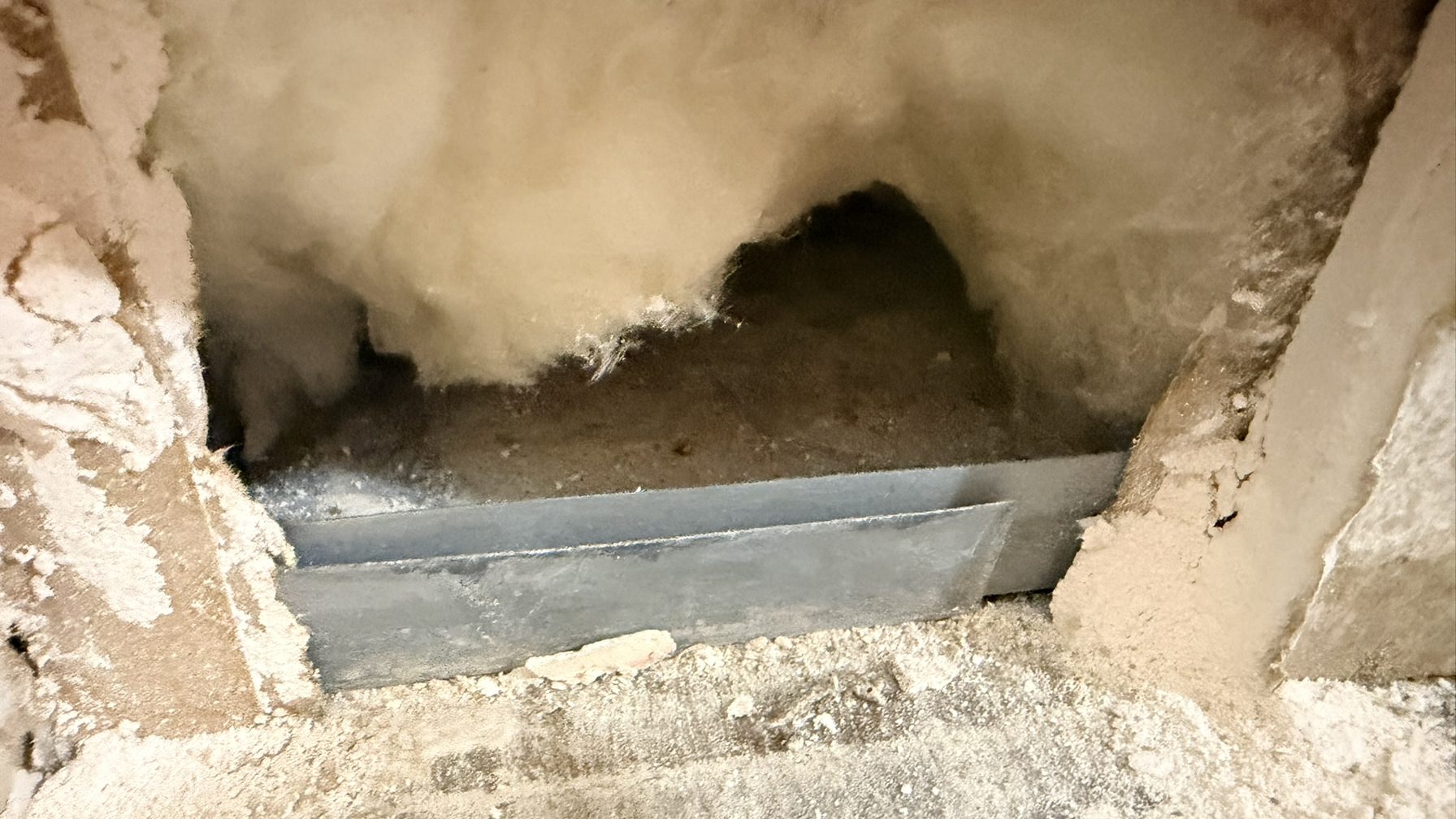 Wall opened to the cavity to check hidden damage