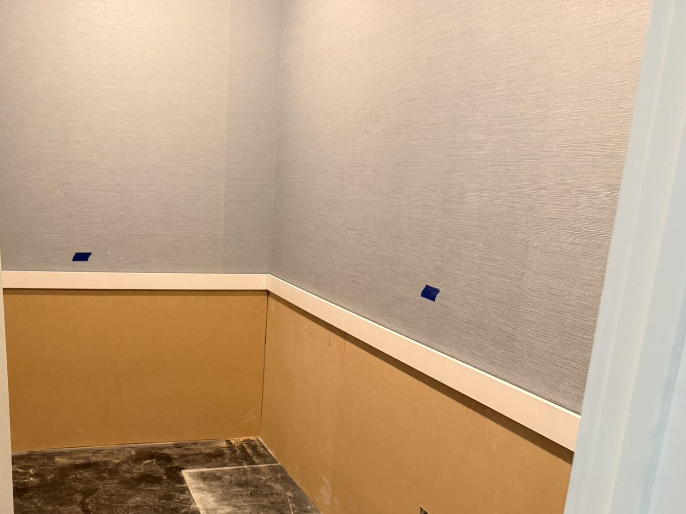 New wainscot and chair rail installed in an emptied room