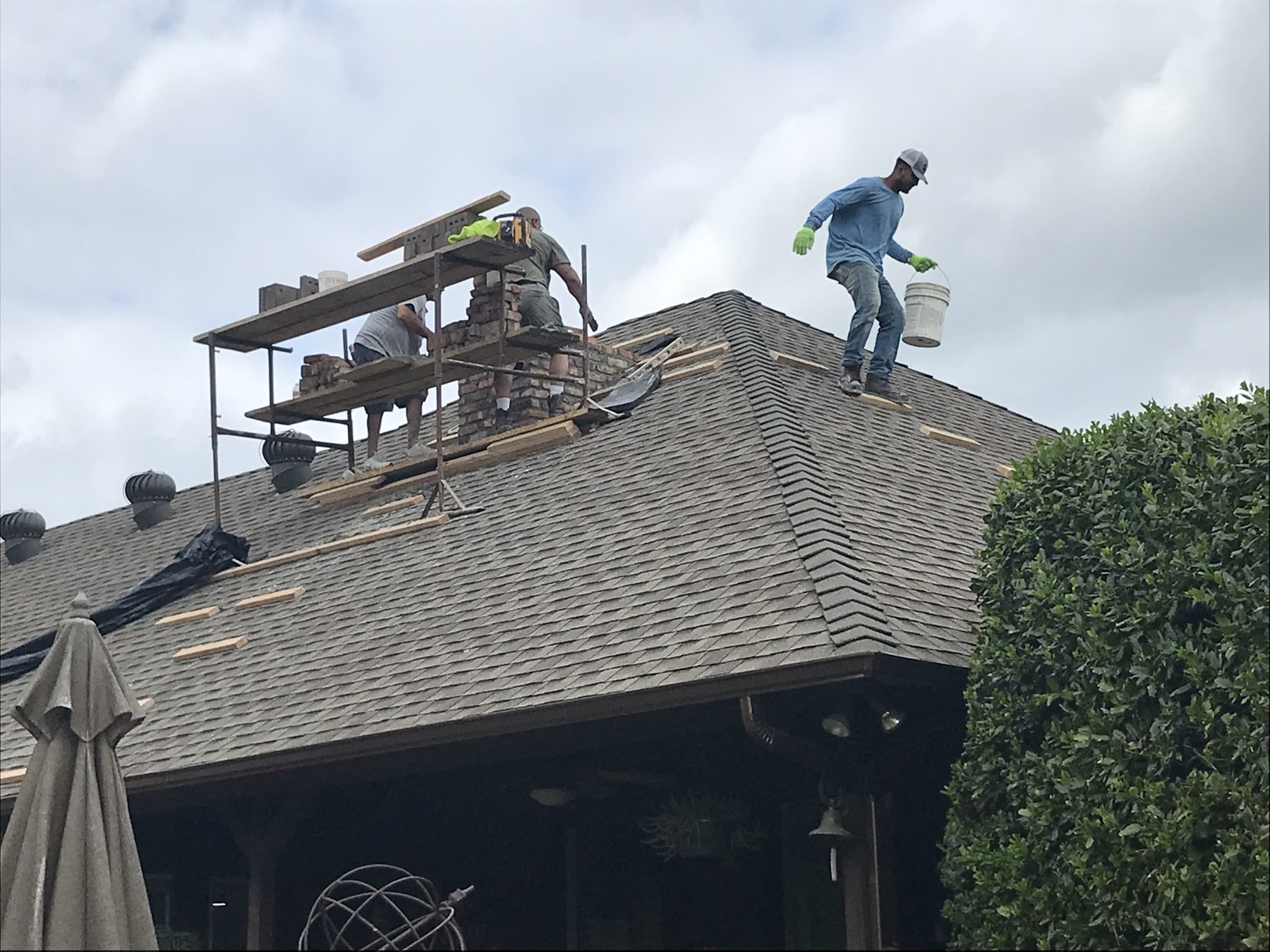 Fort Worth — crew on shingles with chimney scaffolding